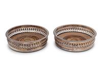 A Pair of Continental Silver-Plate Mounted Wine Coasters