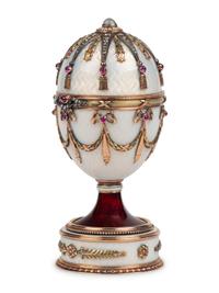 A 14 Karat Vari-Color Gold, Silver, Guilloché Enamel, Diamond, Pearl, and Cabochon Jewel-Mounted Surprise Egg