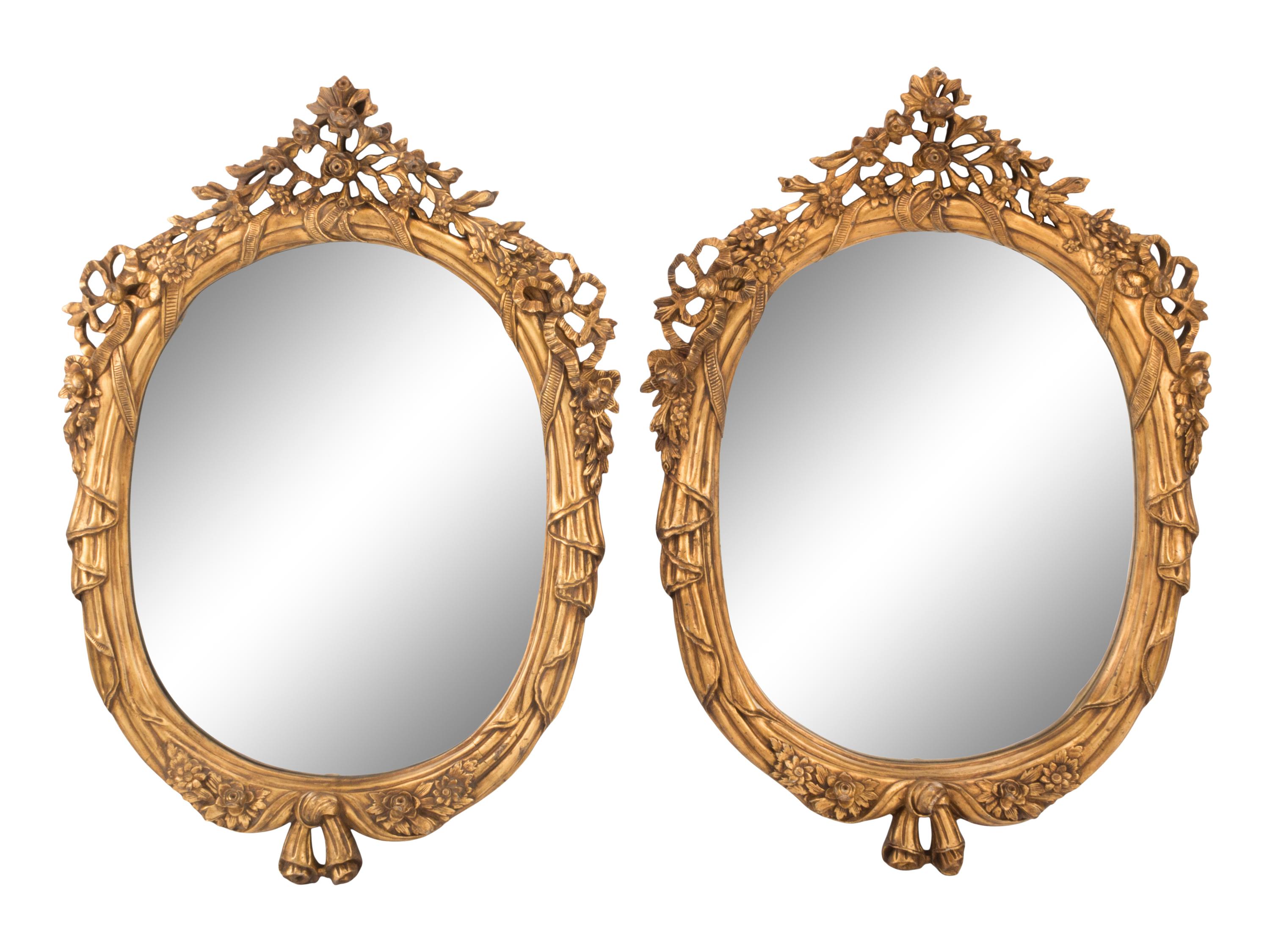 A Pair of Louis XV Style Giltwood Oval Mirrors