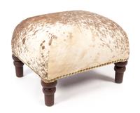 A Cowhide Upholstered Foot Stool Height 13 1/4 inches.
