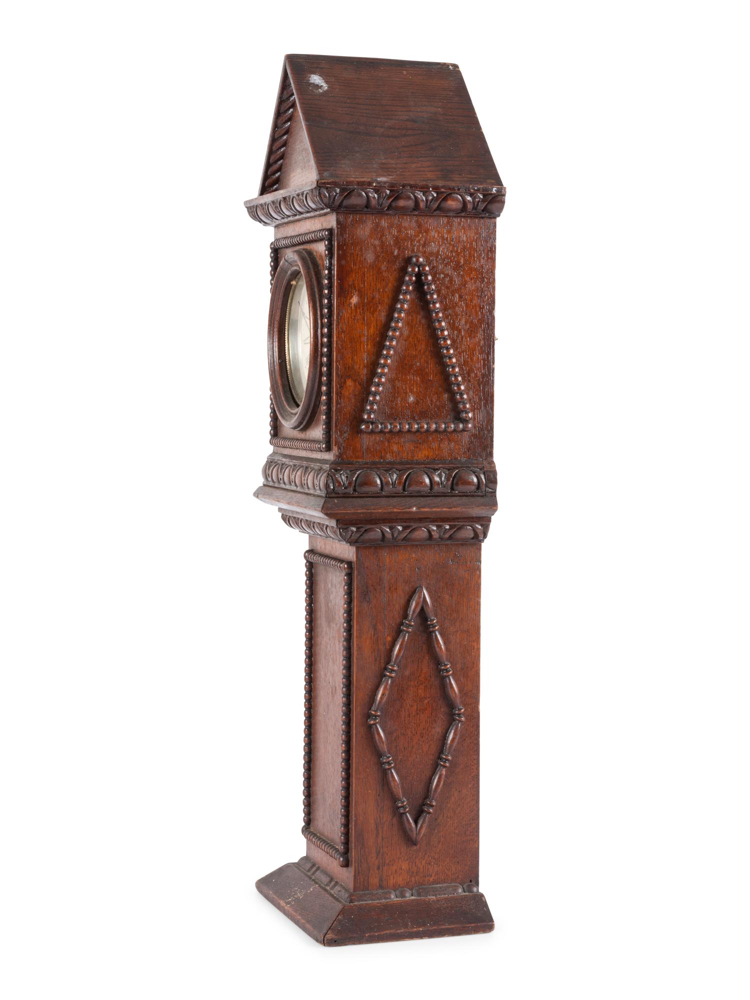 A Miniature Carved Tall Case Clock