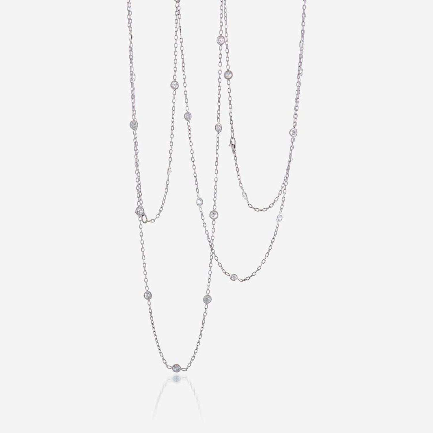 A pair of eighteen karat gold and diamond chains