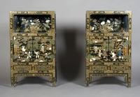 A Pair of Chinese Hardstone and Mother-of-Pearl Inset Cabinets, Height 37 1/2 x width 22 1/4 x depth 11 inches.