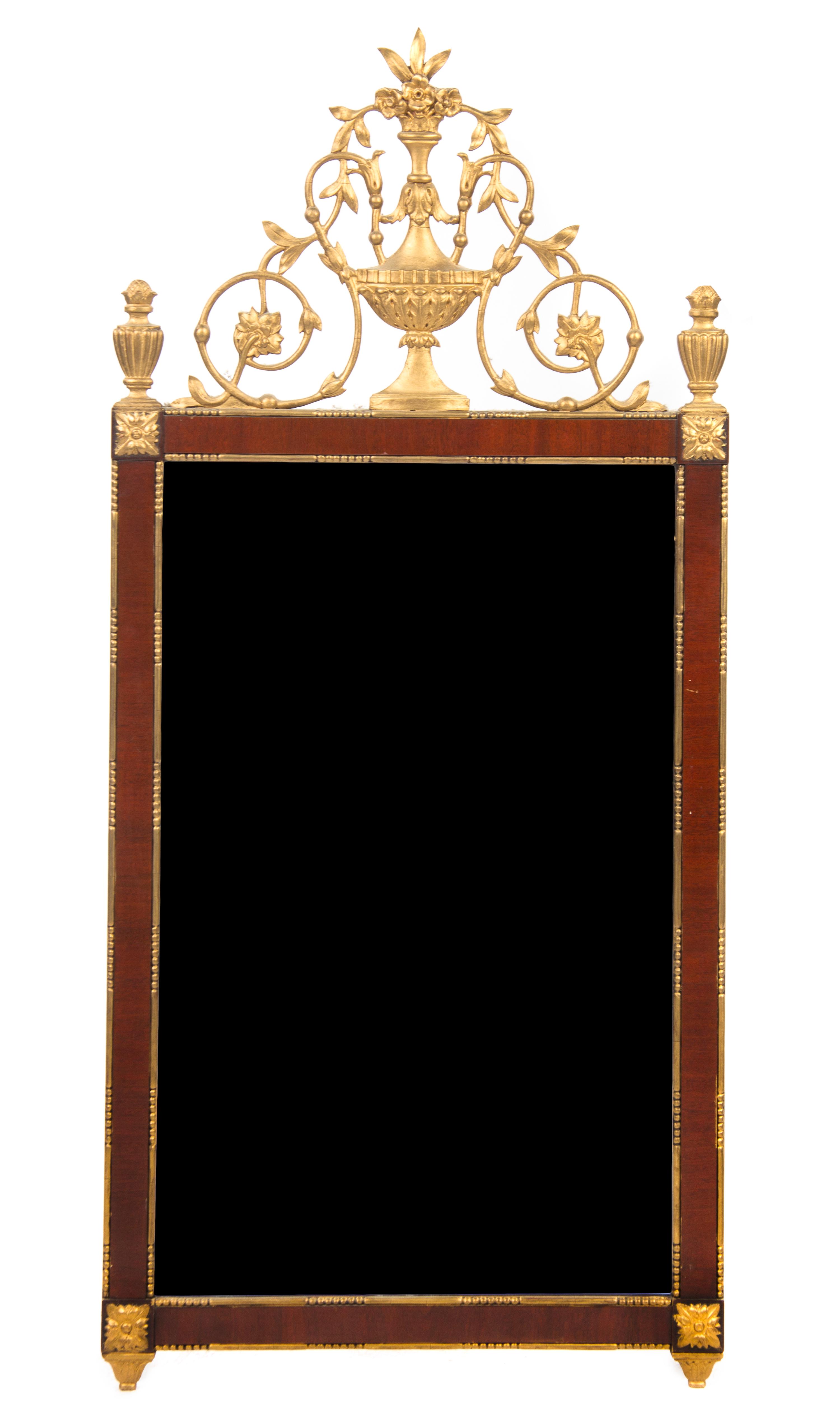 A Neoclassical Mahogany and Parcel Gilt Mirror, Height 61 x width 23 1/4 inches.
