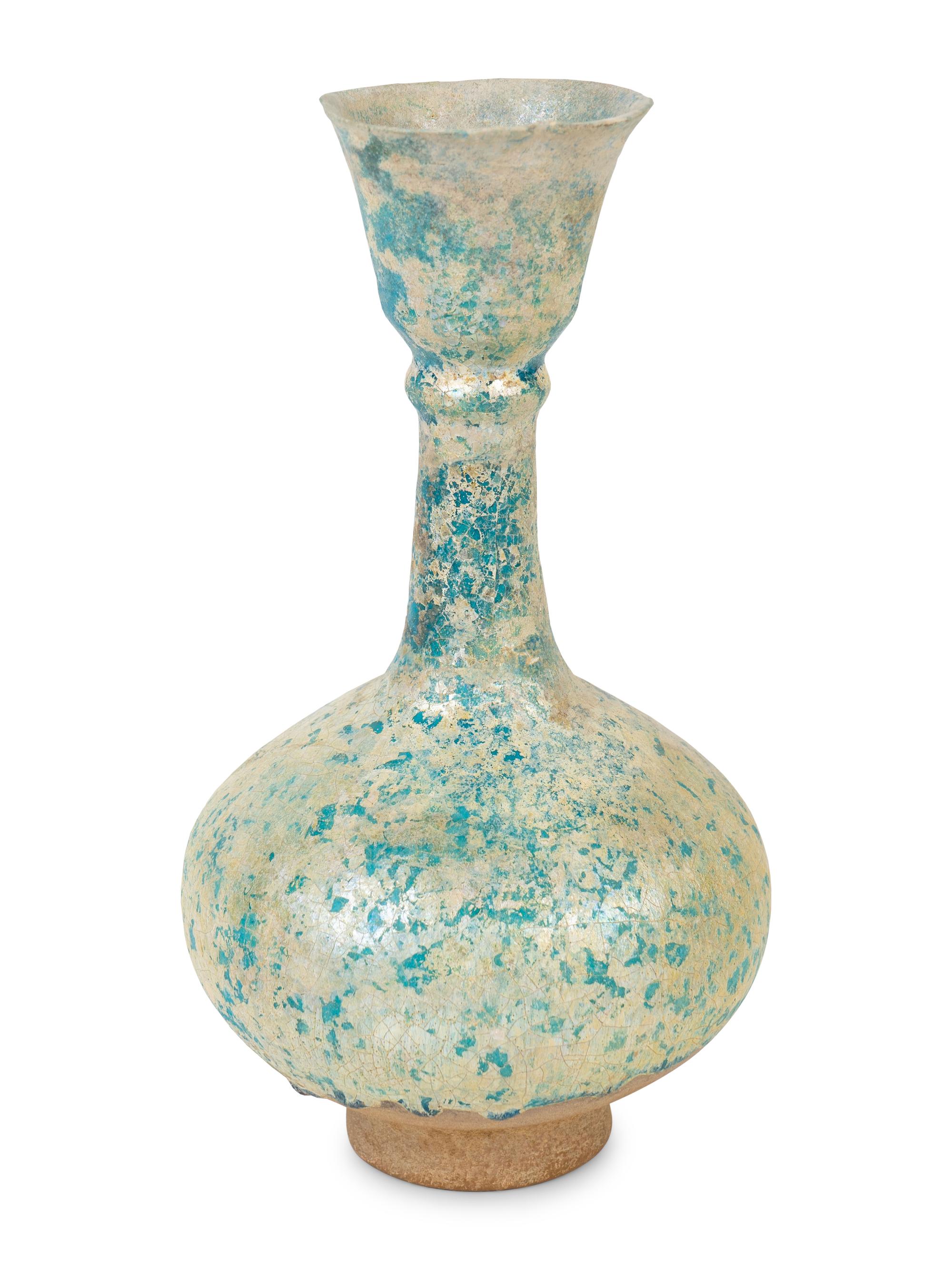 An Iridescent Glazed Earthenware Flask