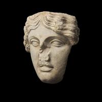 A Roman Marble Fragmentary Head of the Goddess Tyche-Fortuna