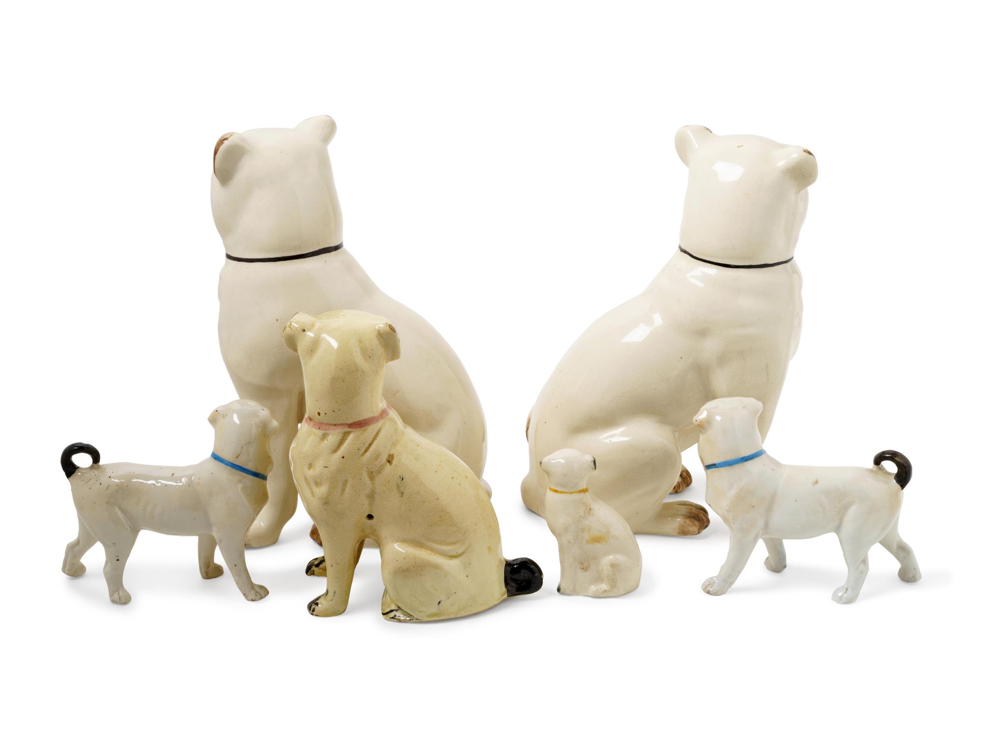 A Group of Glazed Ceramic Pug Figures