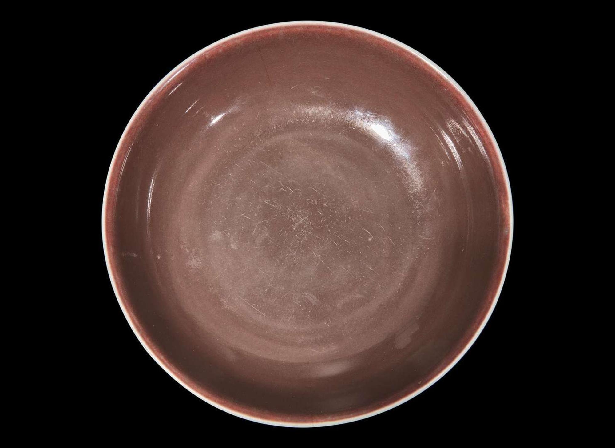 A Chinese copper red glazed dish, Daoguang mark and period 銅紅釉盤 道光款 清道光