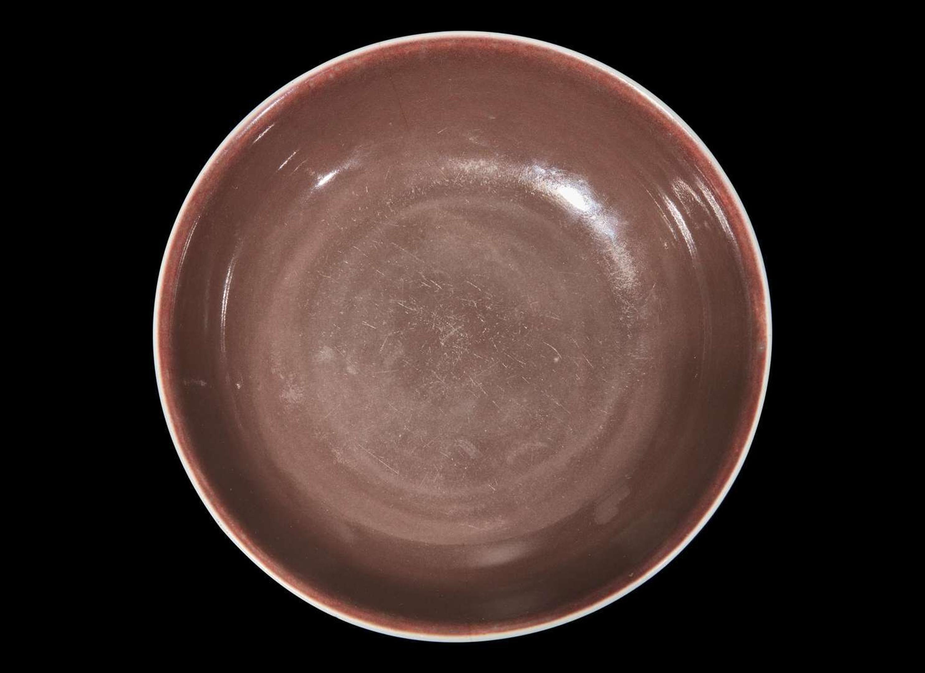 A Chinese copper red glazed dish, Daoguang mark and period 銅紅釉盤 道光款 清道光