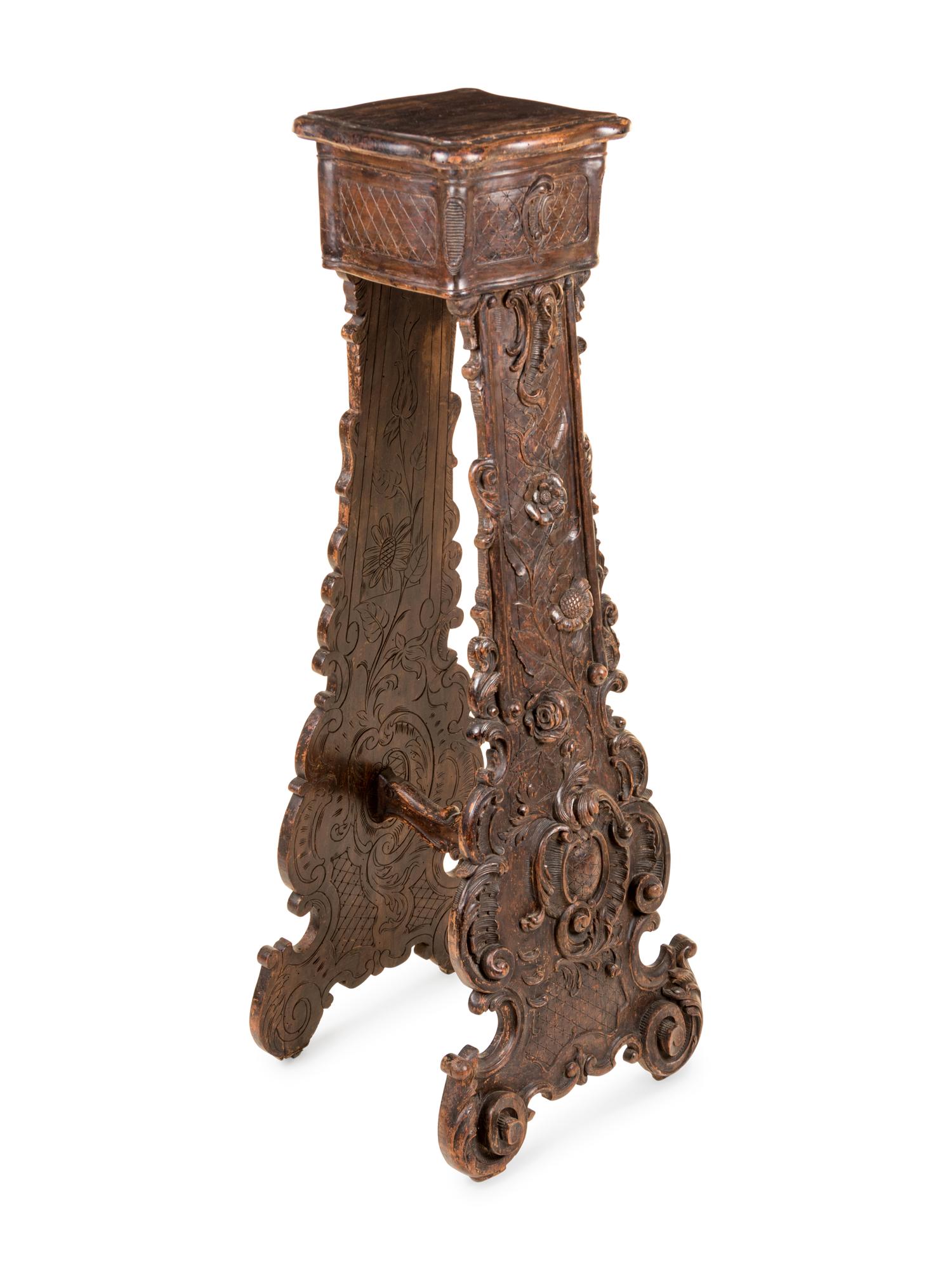 An Italian Baroque Style Carved Walnut Pedestal