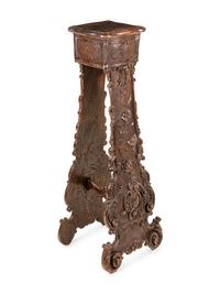 An Italian Baroque Style Carved Walnut Pedestal