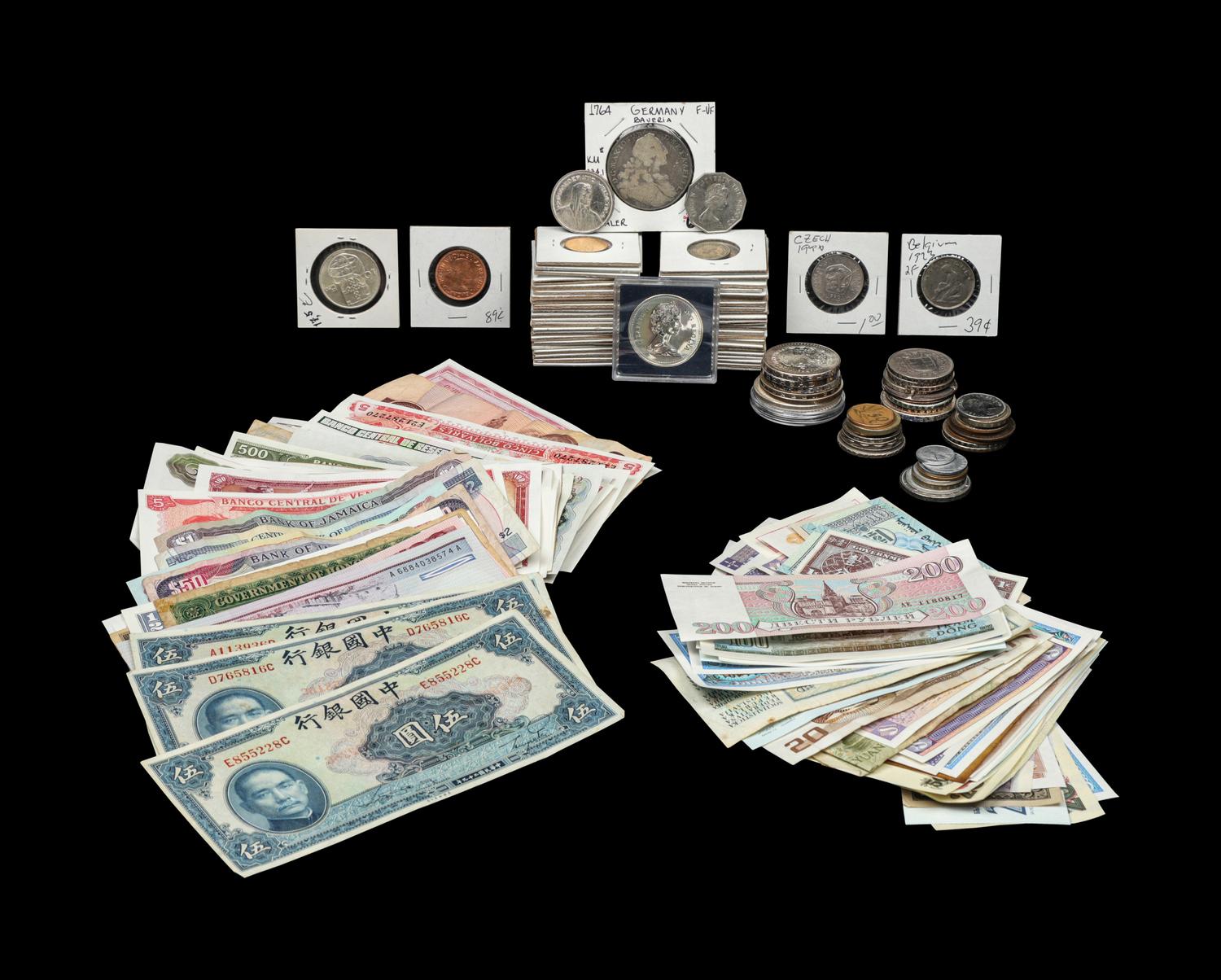 A Large Collection of International Coins and Paper Money