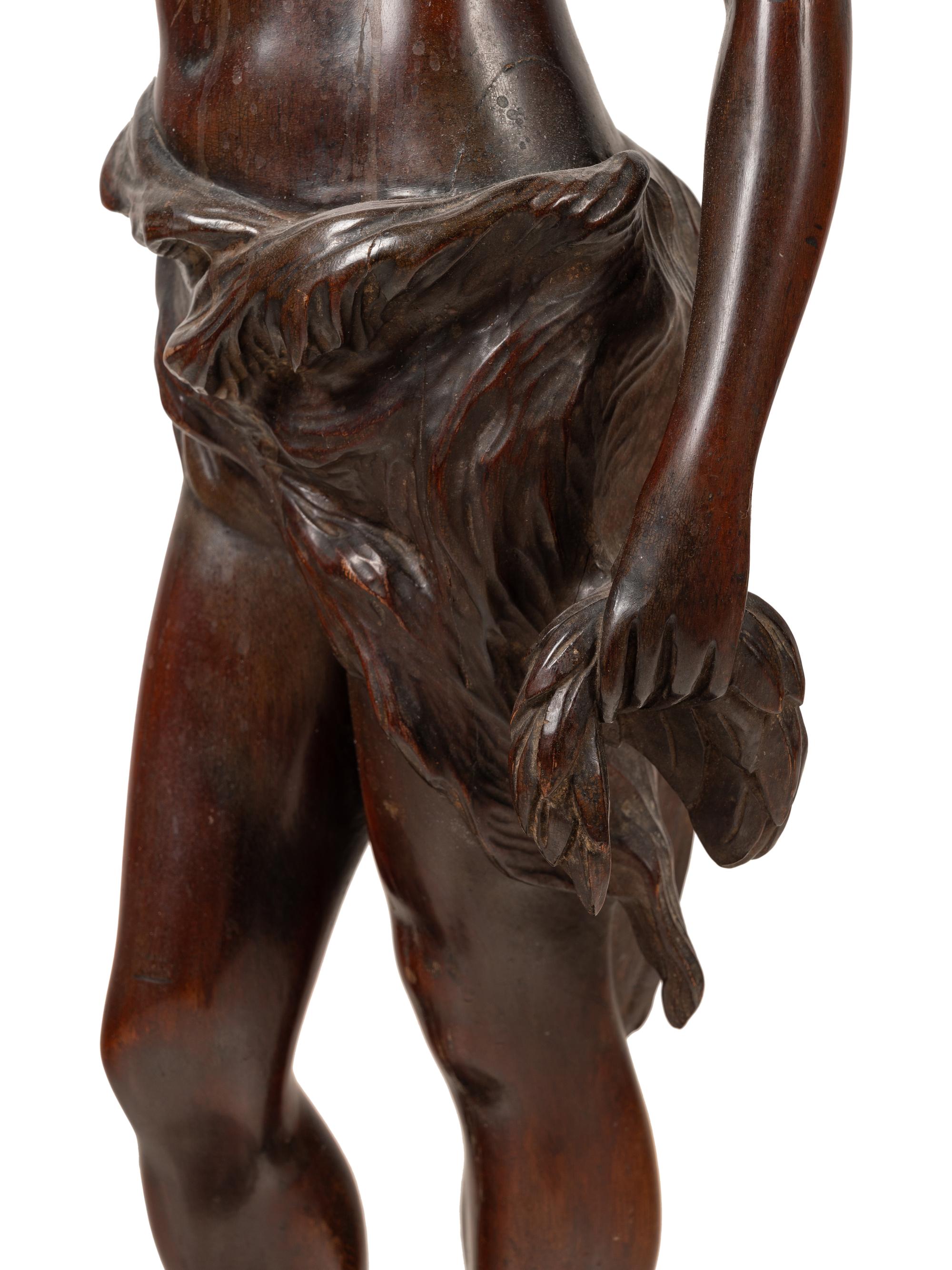A Continental Carved Mahogany Figural Pedestal