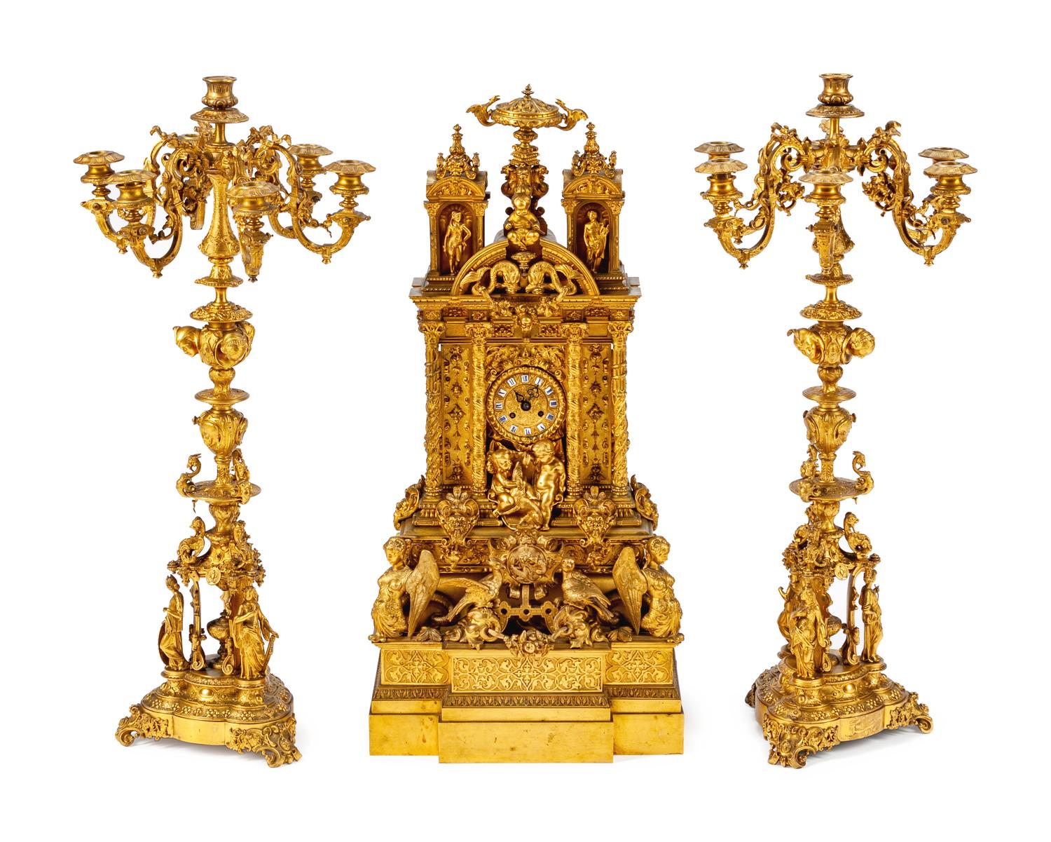 A French Gothic Revival Gilt Bronze Three-Piece Clock Garniture