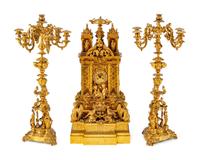 A French Gothic Revival Gilt Bronze Three-Piece Clock Garniture