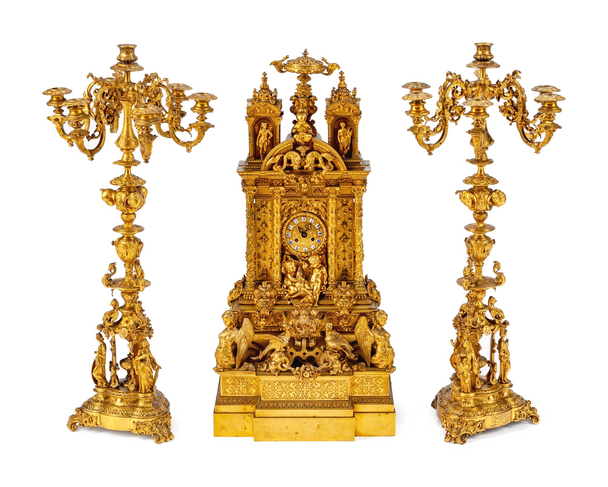 A French Gothic Revival Gilt Bronze Three-Piece Clock Garniture