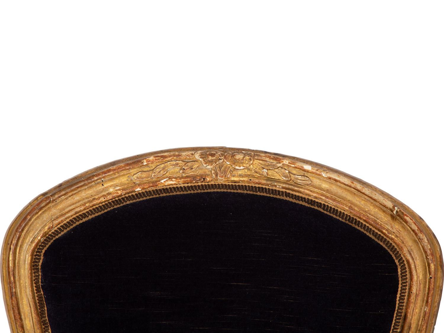 A Pair of Louis XV Giltwood Fauteuils