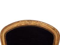 A Pair of Louis XV Giltwood Fauteuils