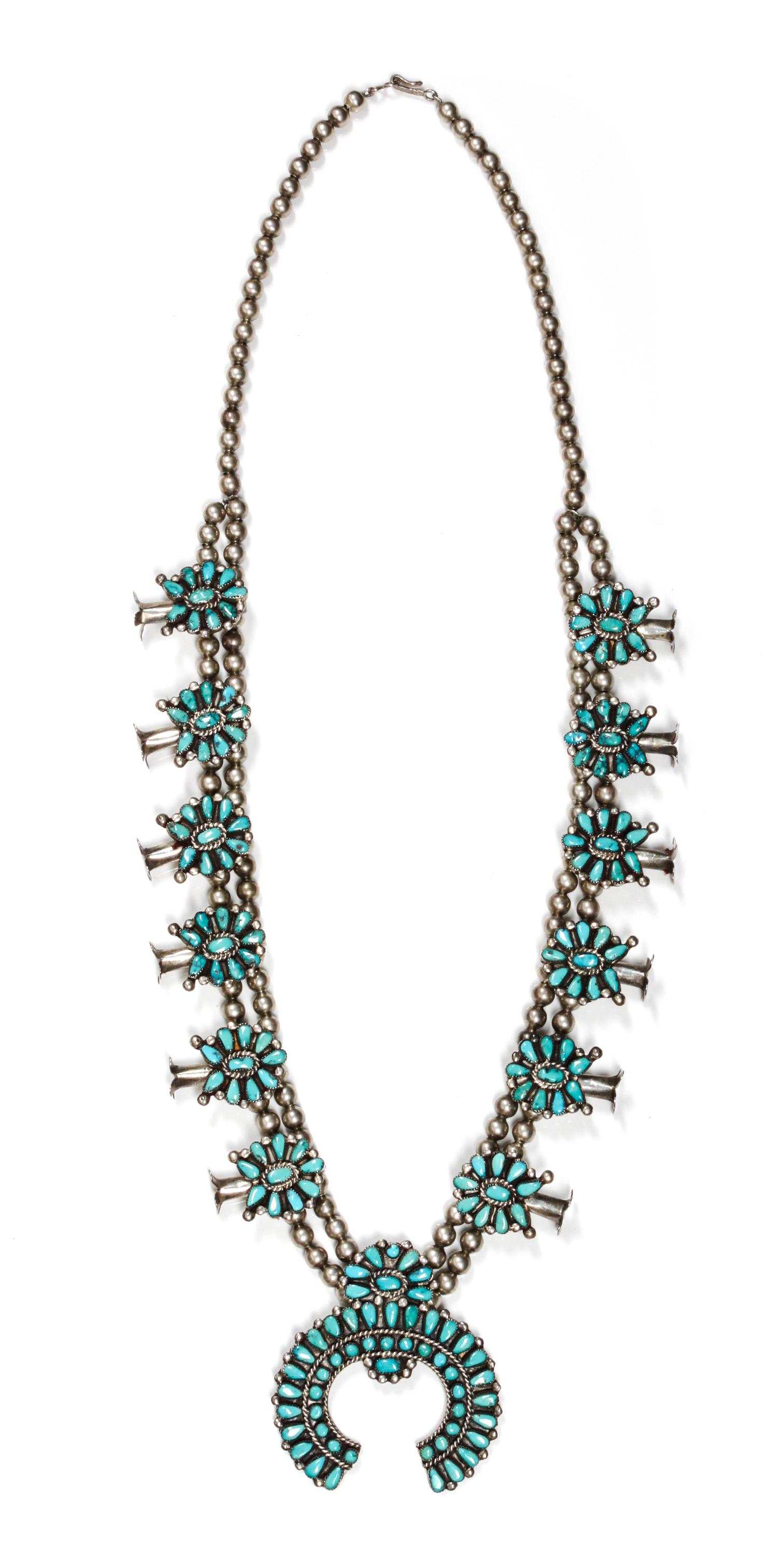 A Zuni Petit Point Silver and Turquoise Squash Blossom Necklace Length 30 inches; naja height 2 1/2 x width 2 1/2 inches.