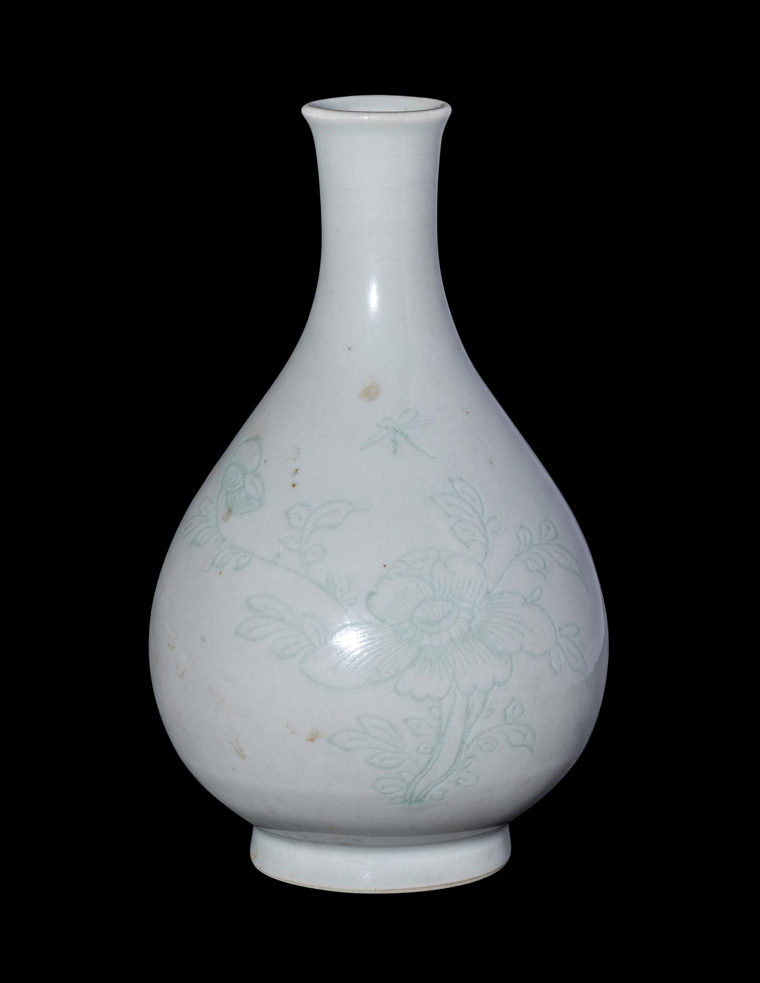 A Chinese Carved White Glazed Porcelain Bottle Vase