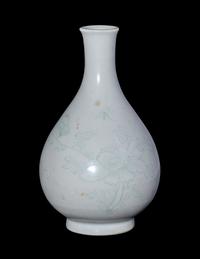 A Chinese Carved White Glazed Porcelain Bottle Vase