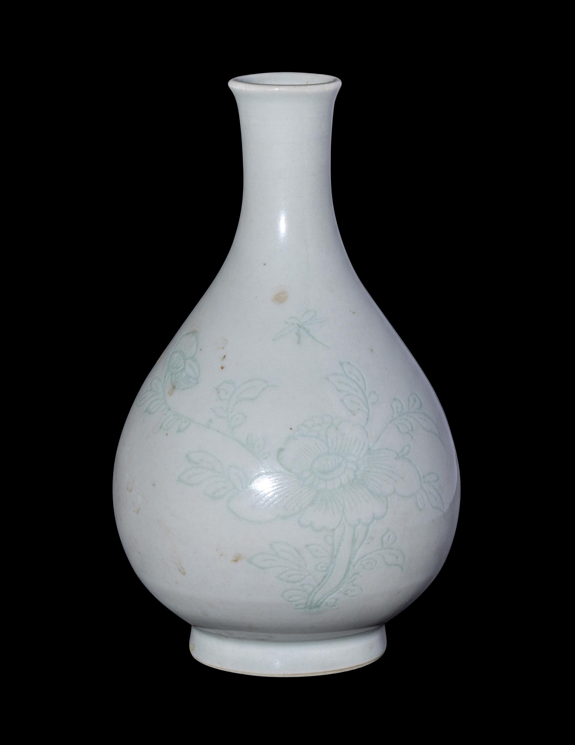 A Chinese Carved White Glazed Porcelain Bottle Vase