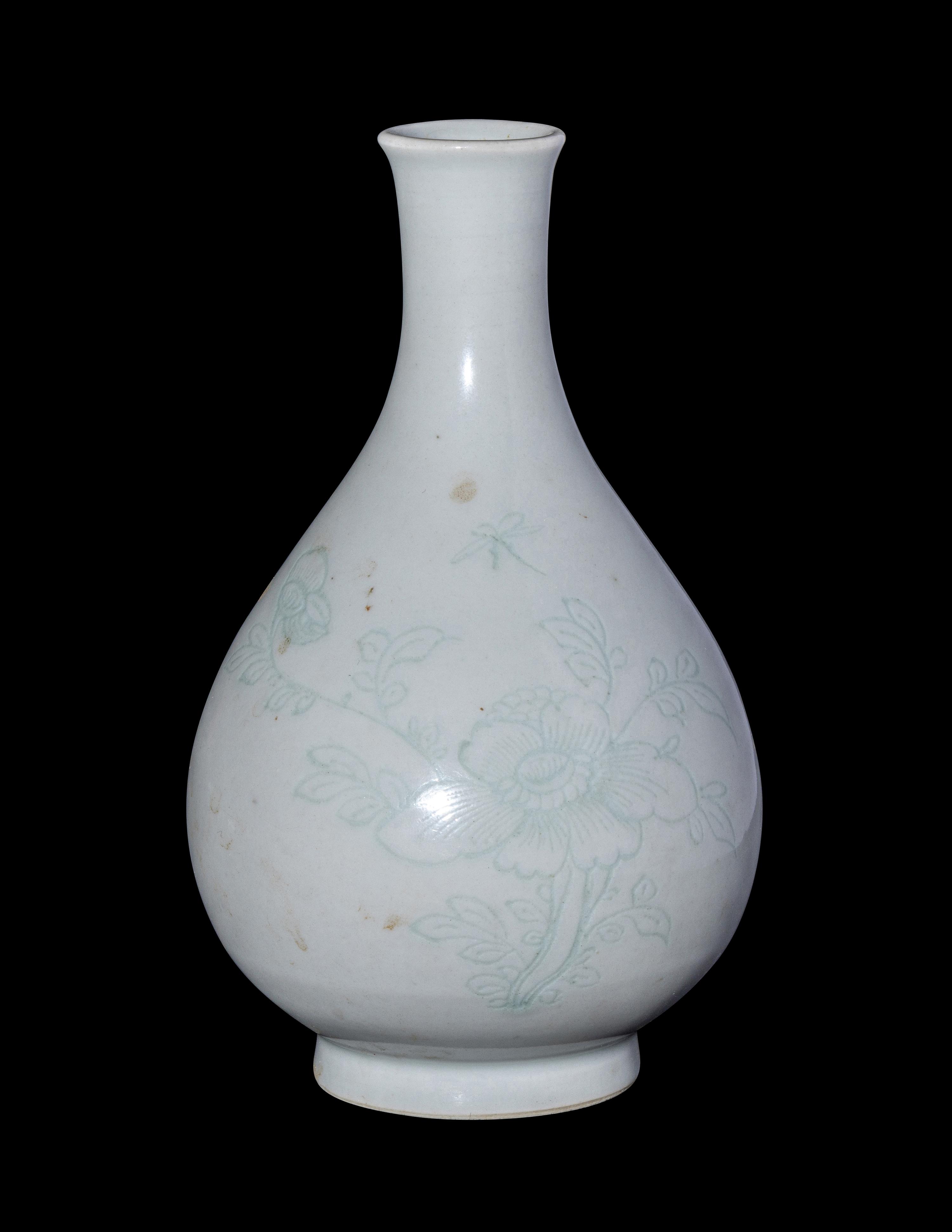 A Chinese Carved White Glazed Porcelain Bottle Vase