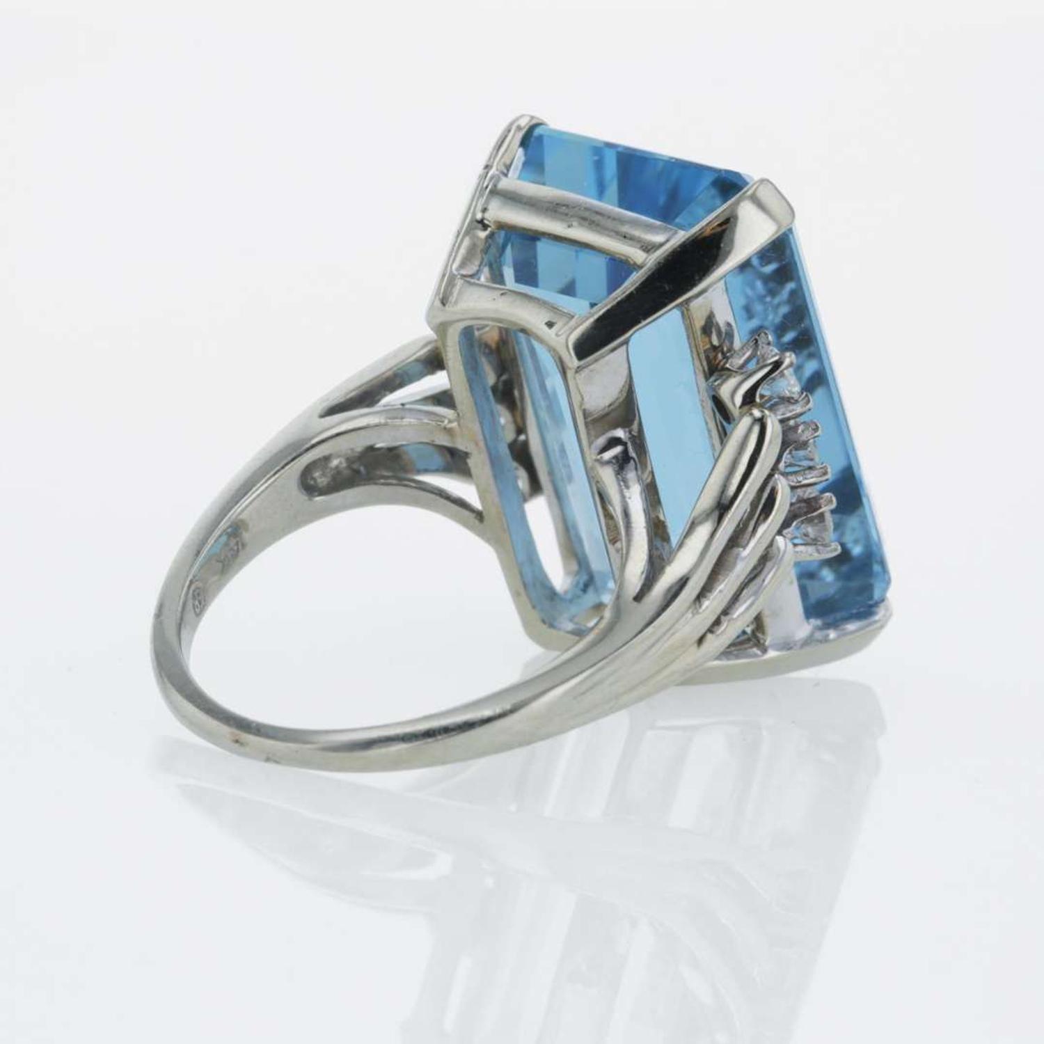 A 14K white gold, aquamarine, and diamond ring