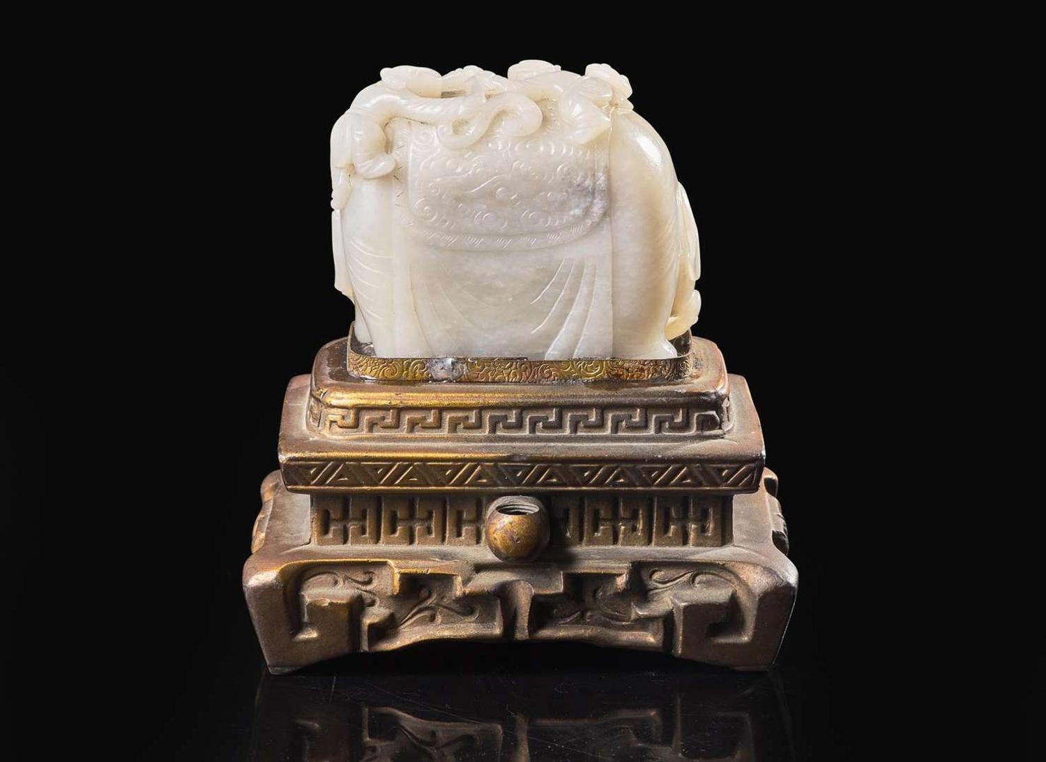 A Chinese carved white and grey jade "Elephant and Boys" group 太童子洗象玉雕