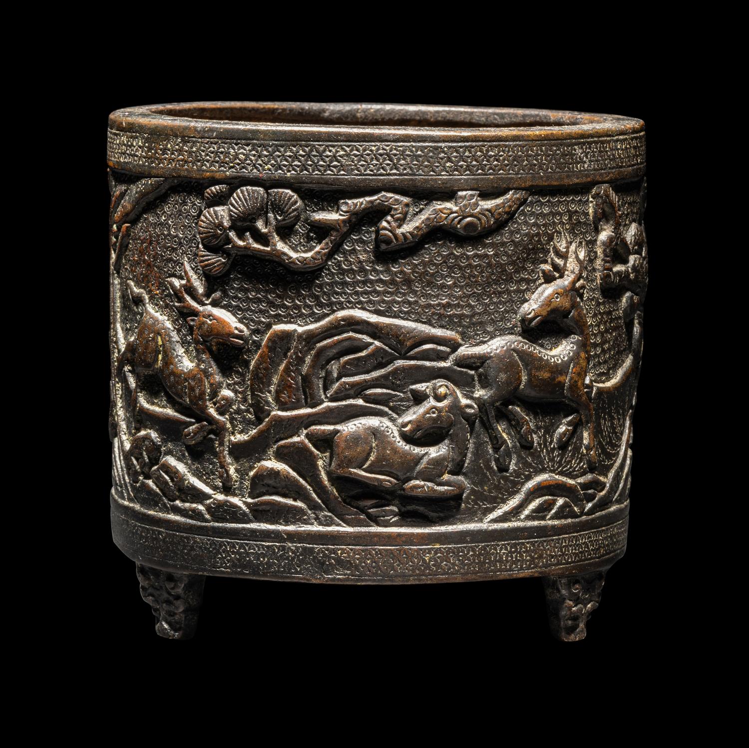 A Chinese Bronze 'Pine and Deer' Incense Burner 銅松鹿圖三足爐