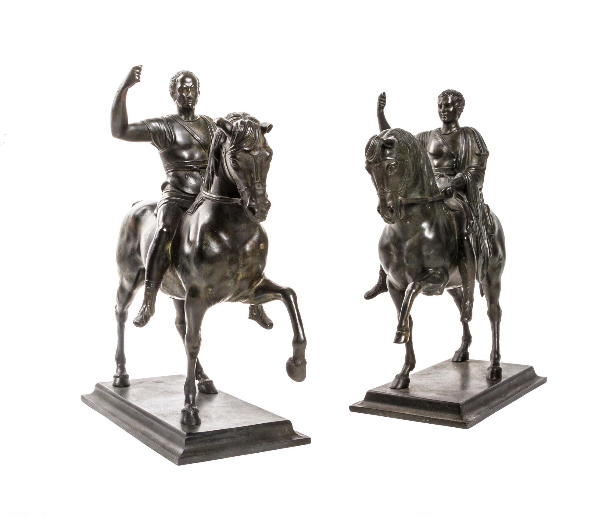 A Pair of Grand Tour Style Bronze Equestrian Groups, after the Antique, Height 14 1/2 inches.
