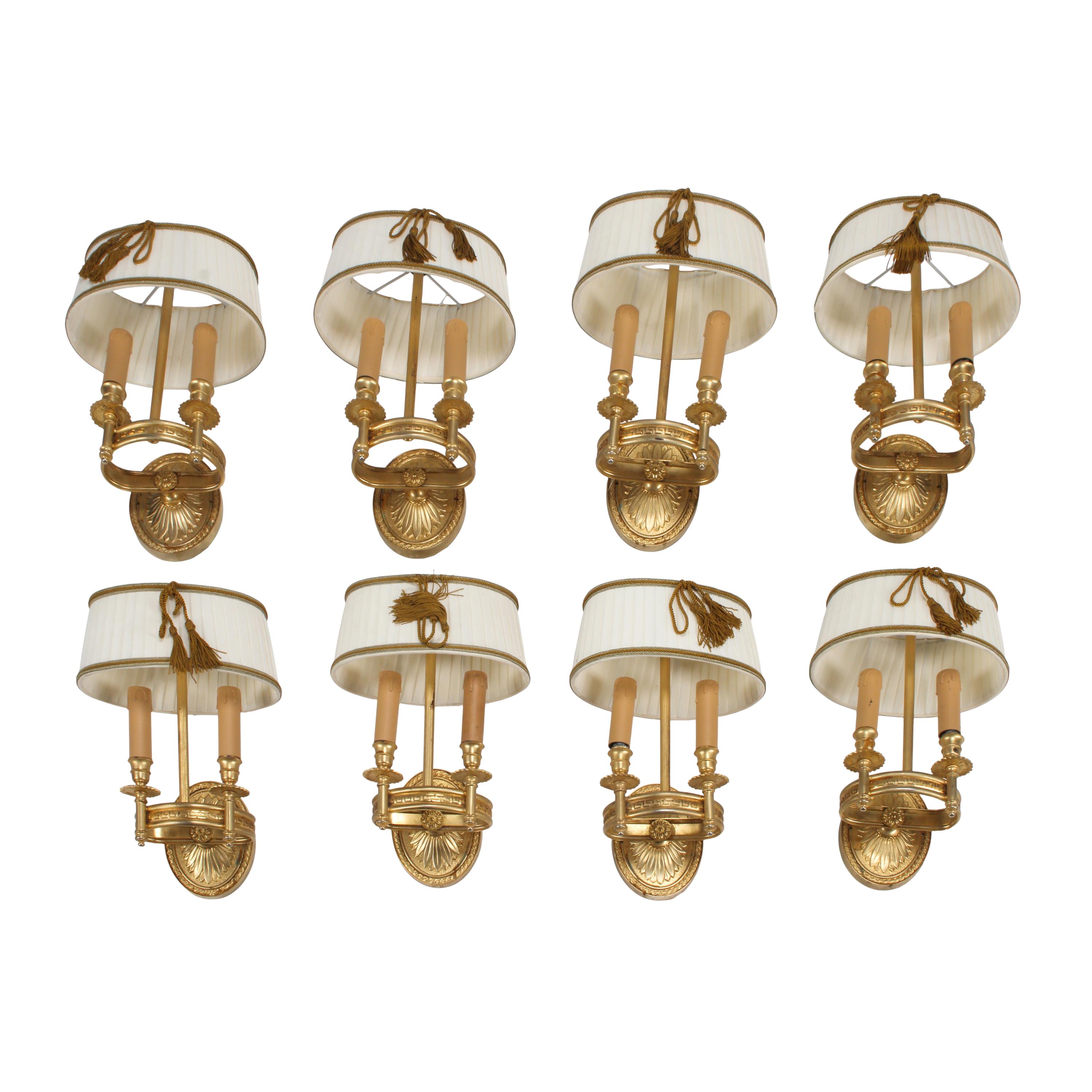 A Set of Eight Empire Style Gilt Bronze Two-Light Sconces