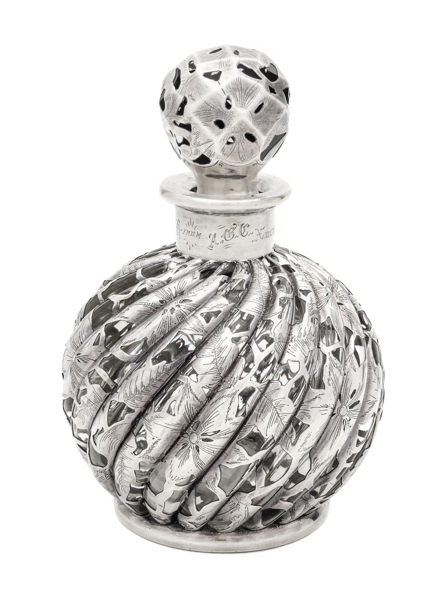 A Silver Overlay Glass Bottle Height 6 3/4 inches.