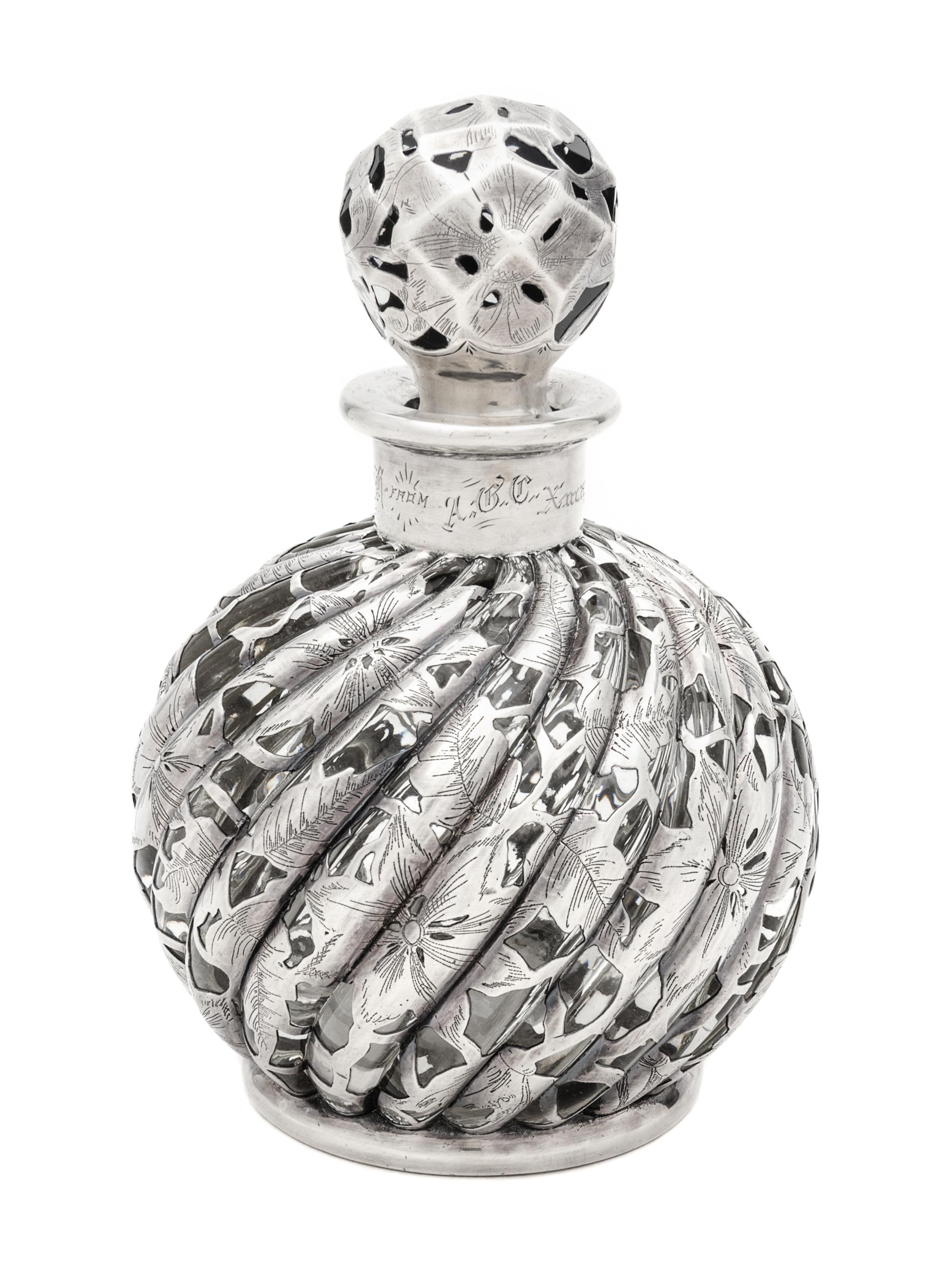 A Silver Overlay Glass Bottle Height 6 3/4 inches.