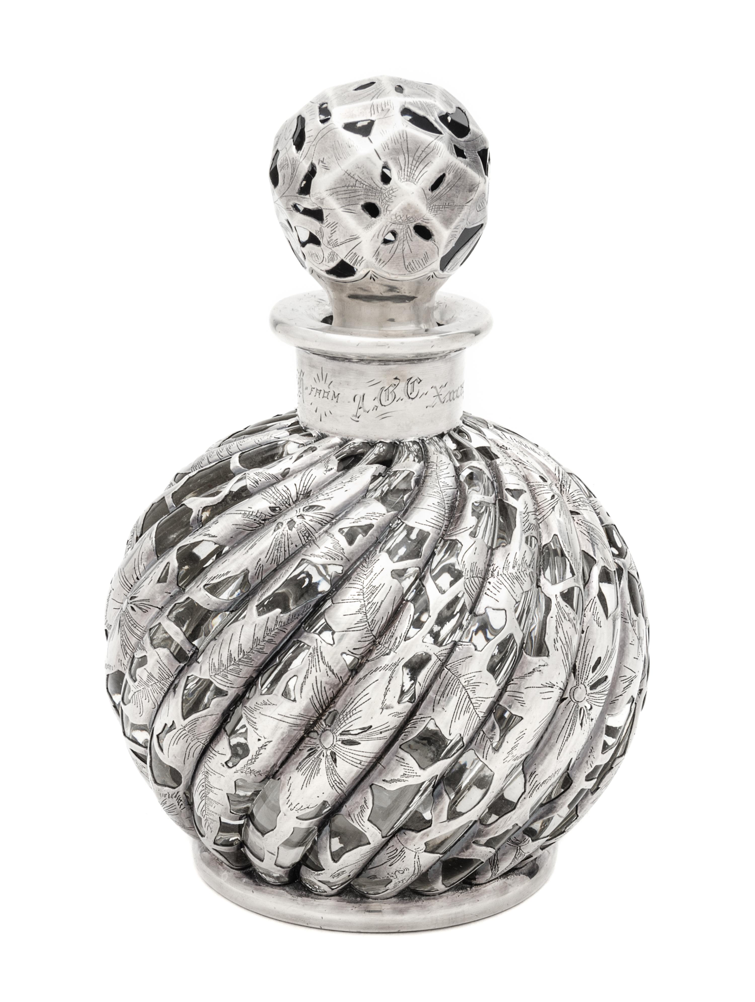 A Silver Overlay Glass Bottle Height 6 3/4 inches.