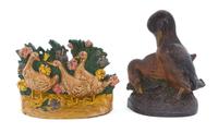 Two Cast Iron Doorstops Height of tallest 8 1/4 inches.