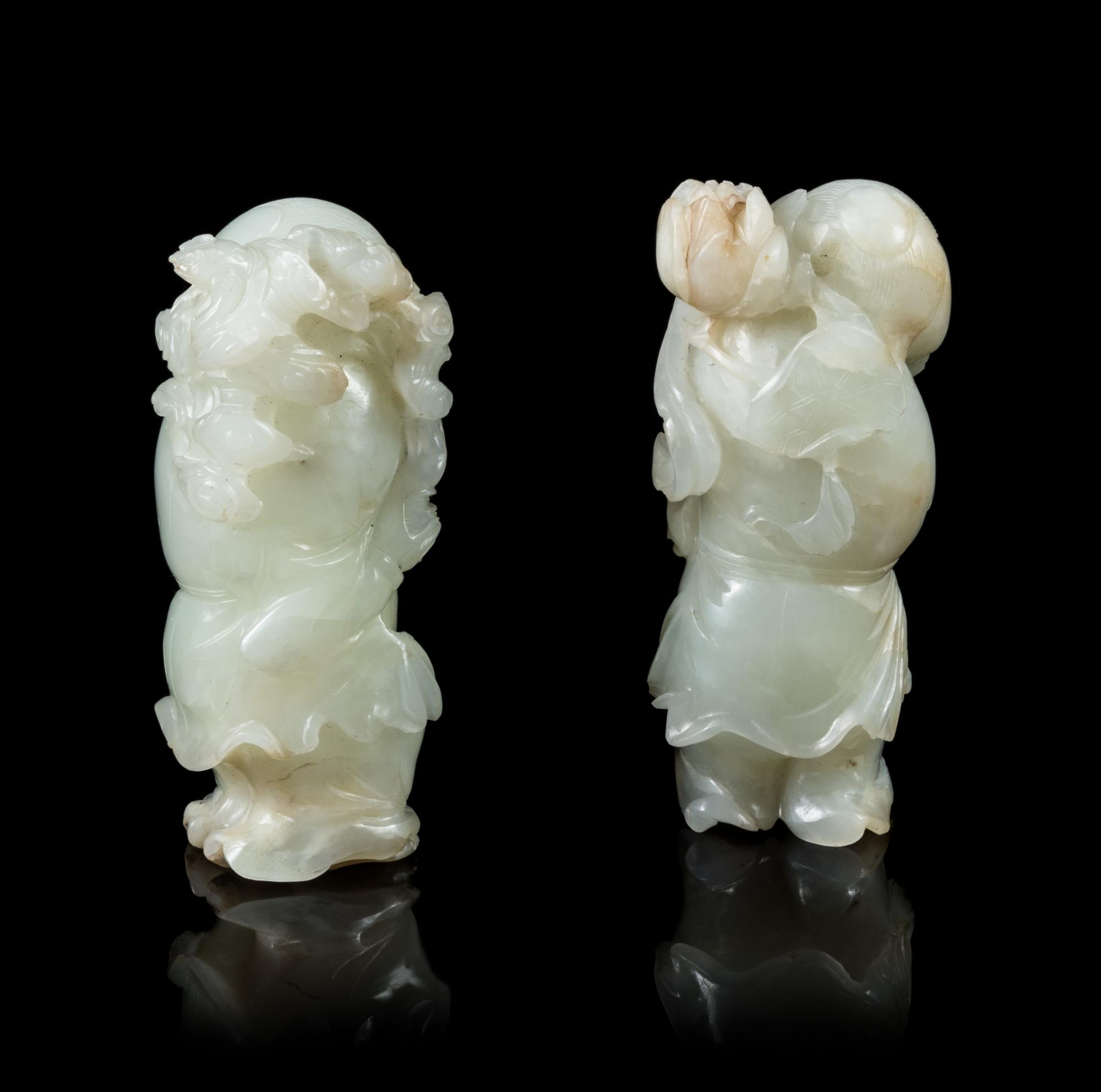 Two Pale Celadon Jade Figures of He He Er Xian Height of taller 3 1/4 inches. — 18TH/19TH CENTURY