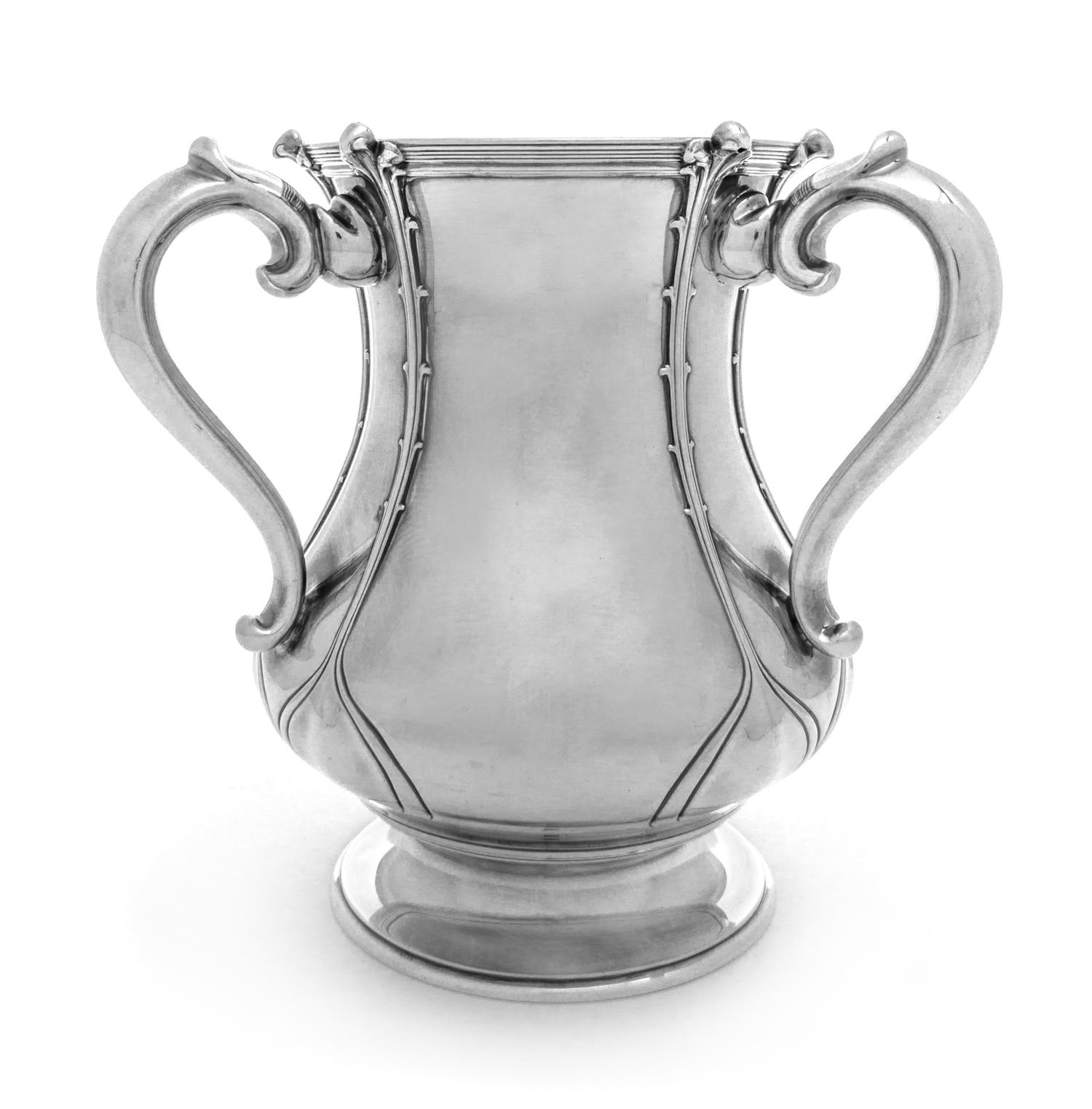 An American Silver Loving Cup, Tiffany & Co., New York, NY, Circa 1902, with applied stylized vines and a gilt interior, raised on a ci