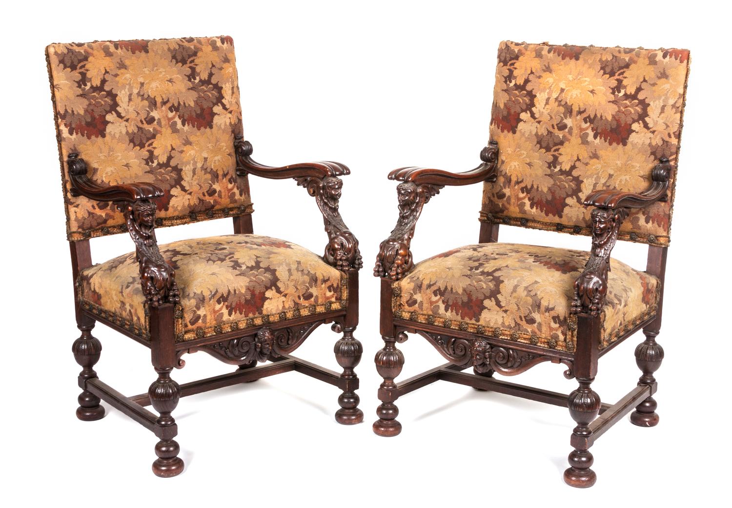 A Pair of Victorian Carved Oak Open Armchairs Height 41 1/4 inches.