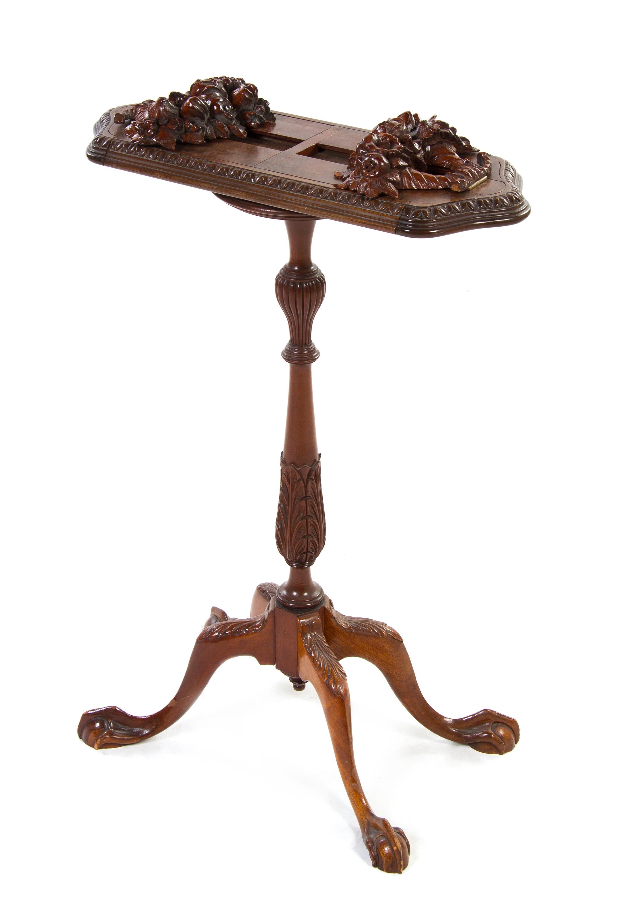 An English Mahogany Book Stand, Height 32 1/2 x width 22 x depth 8 1/2 inches.
