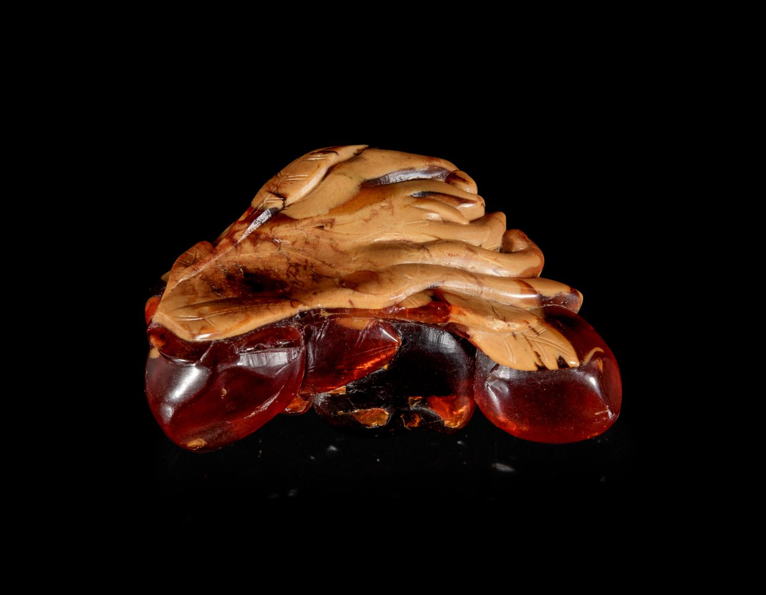 A Carved Amber Hand Citron-Form Snuff Bottle