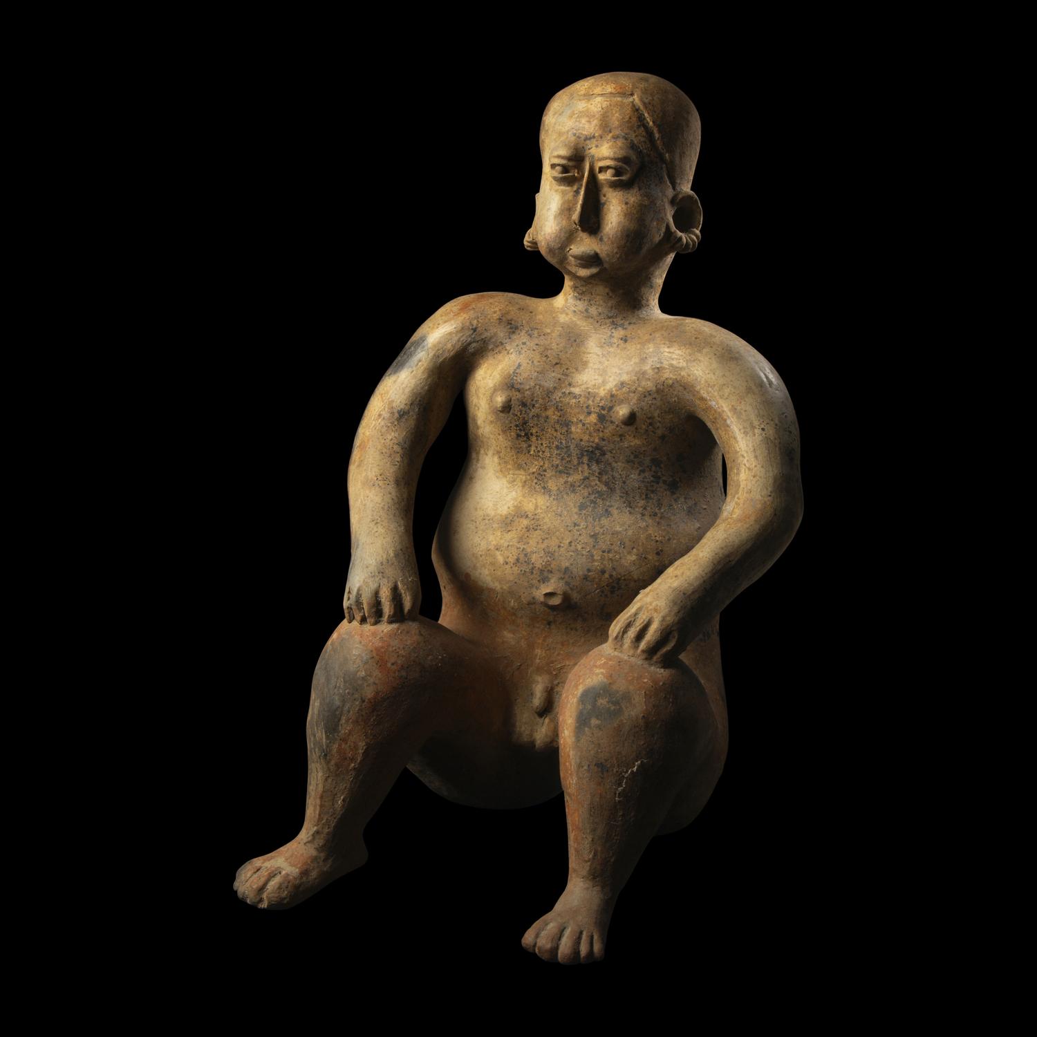 A Jalisco Terracotta Seated Male Figure