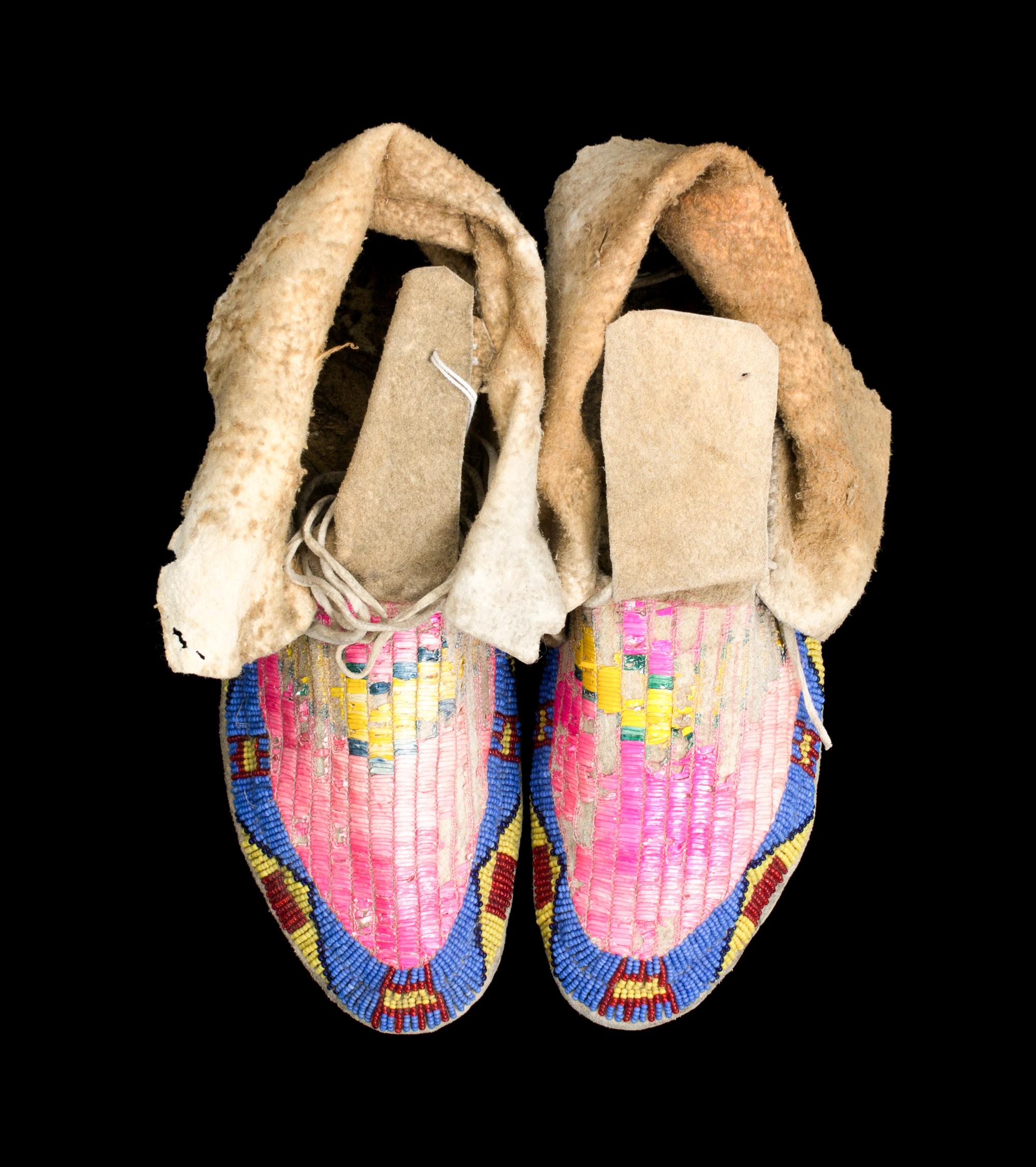 A Pair of Northern Plains Quillwork and Beaded Moccasins Length 10 inches.