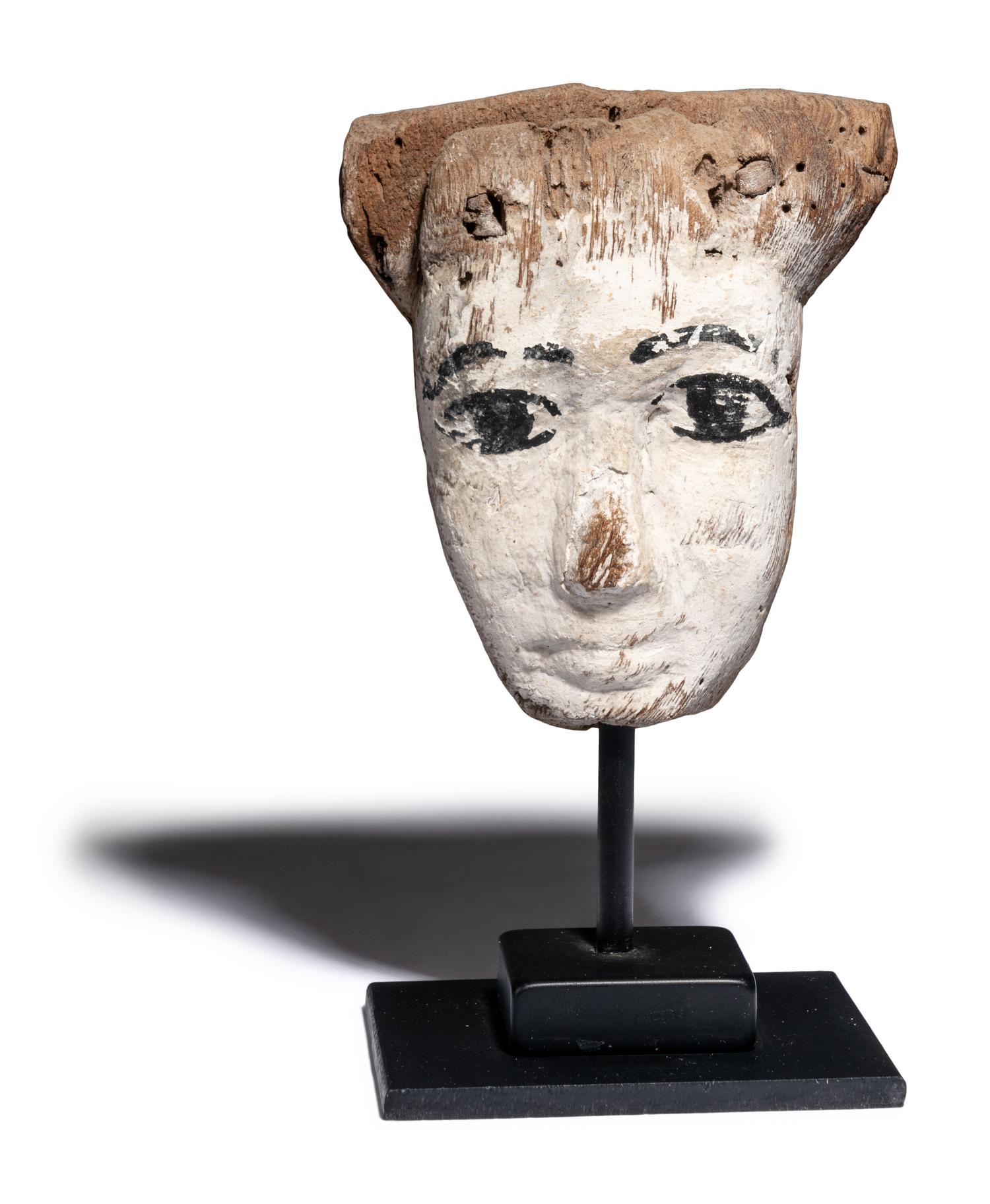 An Egyptian Painted Wood Mummy Mask