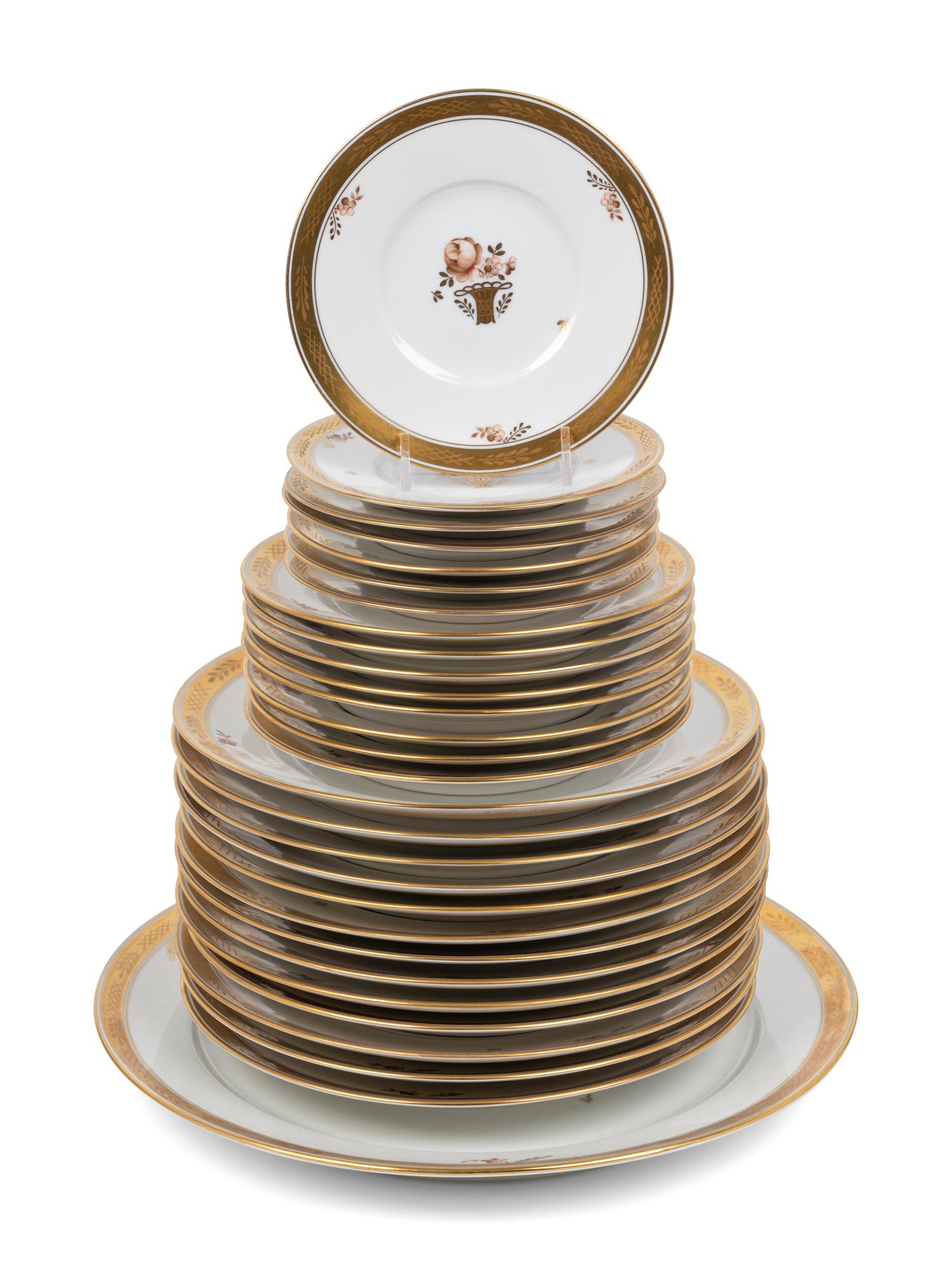 A Royal Copenhagen Gold Rose Porcelain Dinner Service