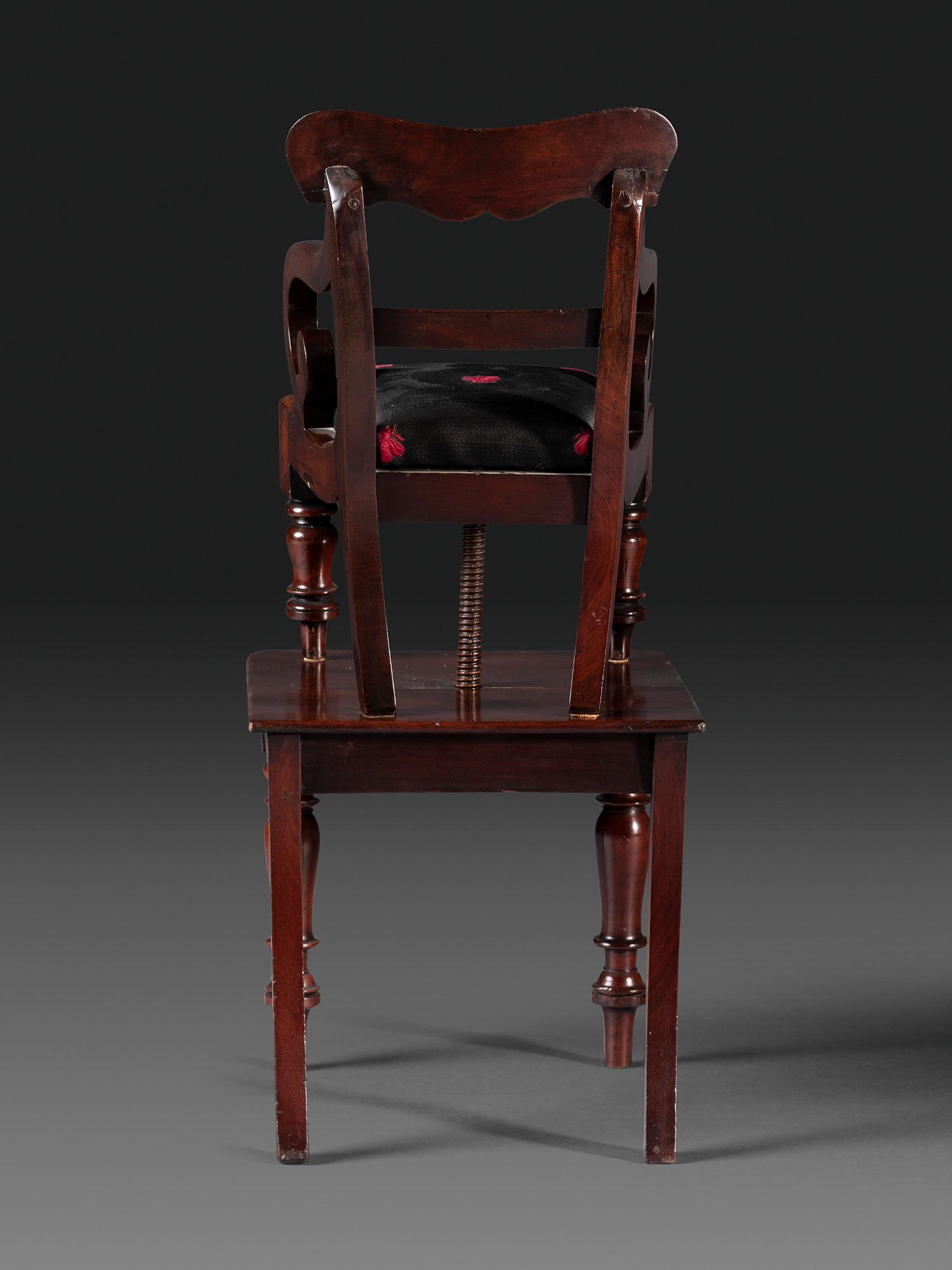 A Classical Carved Mahogany Child's Chair on Stand