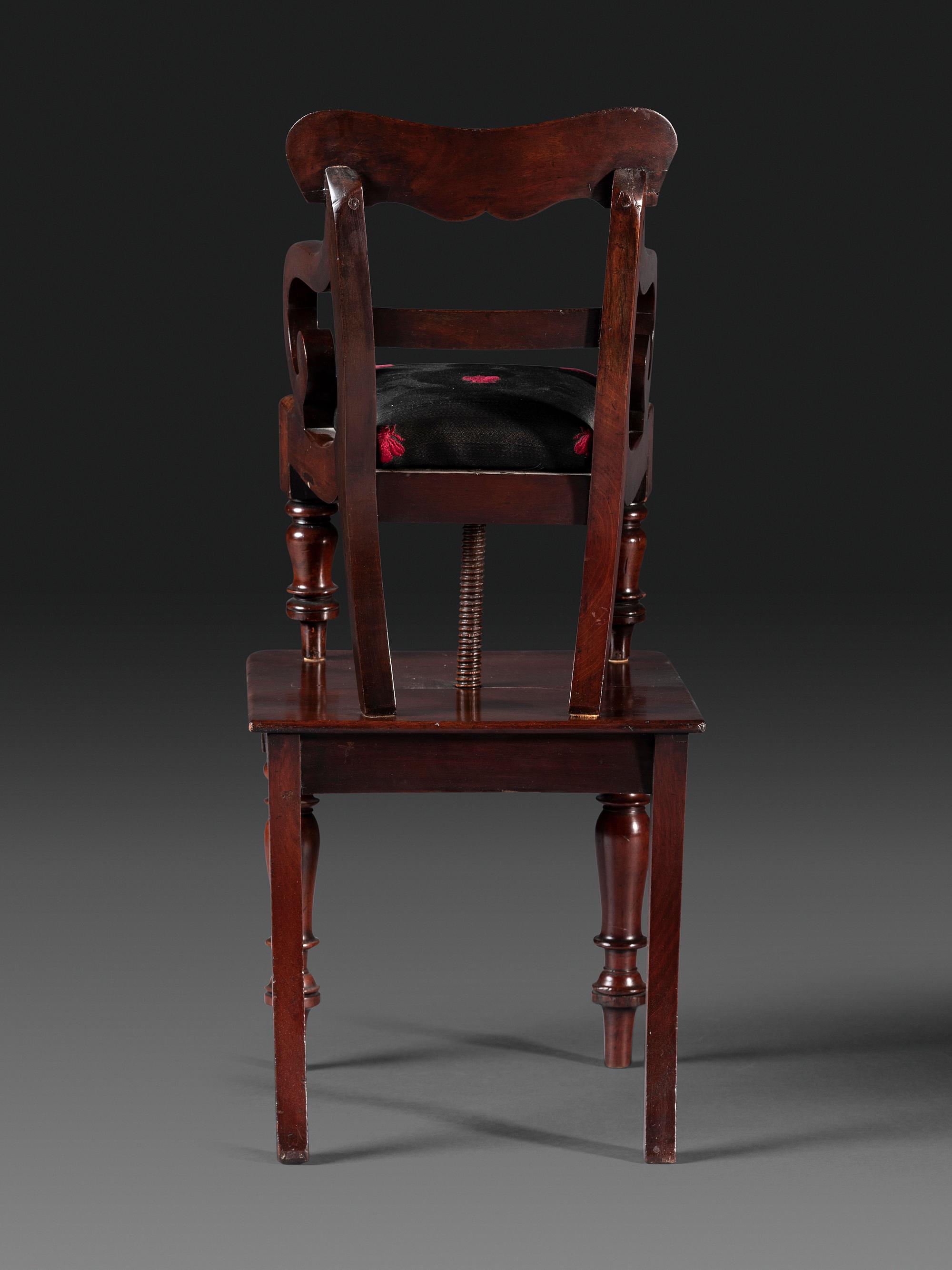 A Classical Carved Mahogany Child's Chair on Stand