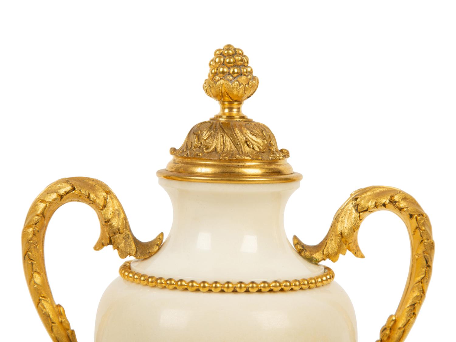 A Pair of Empire Style Gilt Bronze Mounted White Marble Urns — 19TH/20TH CENTURY