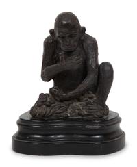 A Continental Bronze Sculpture of a Seated Monkey