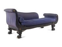 An Empire Style Gilt Metal Mounted Ebonized Chaise Longue